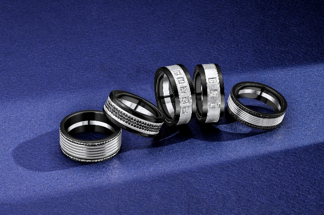 Five black and silver wedding rings